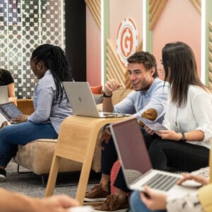 A group of coworkers talking in a recreational space